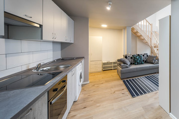 Light interior of room in apartment. Private house. Living room and kitchen.