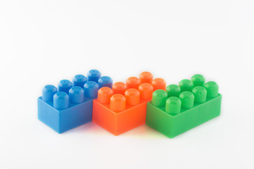 blocks of the children's designer of orange, blue and green color on a white background
