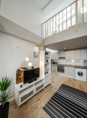 Light interior of room in apartment. Private house. Living room and kitchen.
