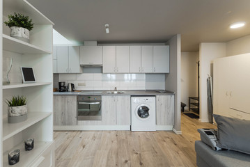 Light interior of room in apartment. Private house. Living room and kitchen.