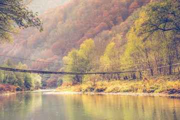 Old wooden bridge autumn background