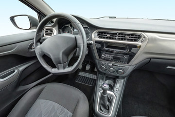 panorama in interior leather salon of prestige modern car. steering wheel, shift lever and dashboard
