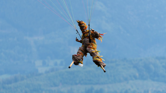 Paraglider pilot is flying with a costume under Coupe Icare 2019 in France