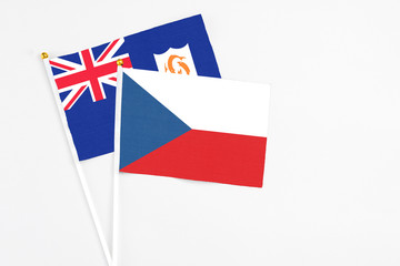 Czech Republic and Anguilla stick flags on white background. High quality fabric, miniature national flag. Peaceful global concept.White floor for copy space.