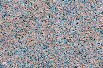 Granite texture, red base color with blue, black and gray spots. Floor material, wall material, construction material