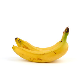 ripe yellow bananas in a peel on a white background