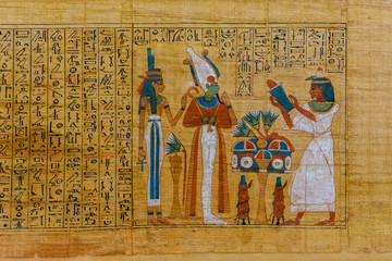 Egyptian ancient papyrus with the different pictures and hieroglyphics