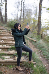 Fototapeta premium happy young woman taking selfie