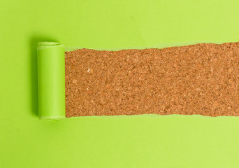 Obraz premium Cardboard which is torn in the middle placed above a wooden classic table