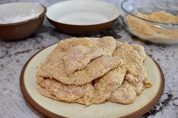 Fried chicken ingredients with chicken breasts ready to be cooked