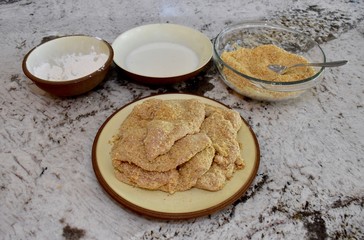 Fried chicken ingredients with chicken breasts ready to be cooked