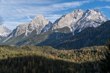 Zugspitze glacier peaks raising above autumn forest