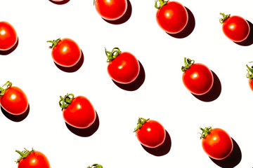 Cherry tomatoes over white background