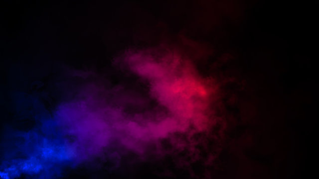 Abstract multi color fog smoke effects on isolated black background.