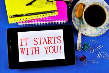 It all starts with you-an inspirational message on your tablet PC. Show courage, the result: growth, development, craving for discovery, understanding that you can control everything.