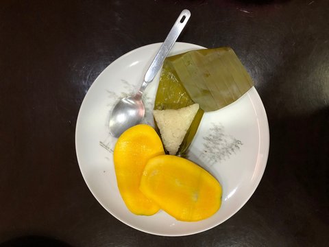 Suman or Filipino Rice Cake with Mango Slices