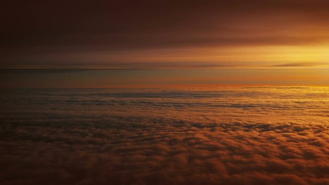 Sunset above the clouds in 4K 