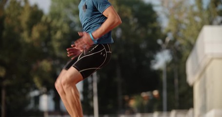 Professional athlete warming up at start of his training in morning, preparing for tournament - sports, fitness concept 4k footage - Powered by Adobe