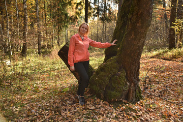 portrait of a blonde against the forest