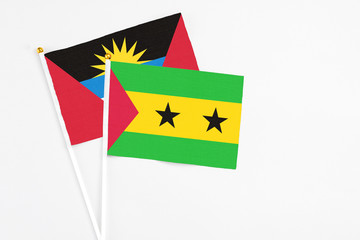 Sao Tome And Principe and Antigua and Barbuda stick flags on white background. High quality fabric,...