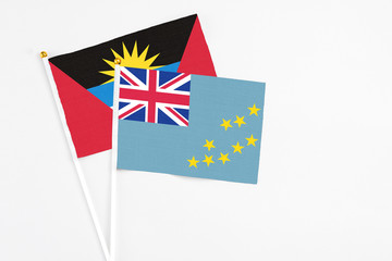 Tuvalu and Antigua and Barbuda stick flags on white background. High quality fabric, miniature...