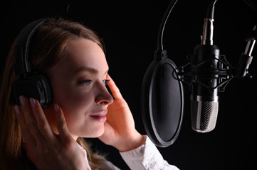 Singer, blogger, voice acting. Work in the studio with a studio microphone.