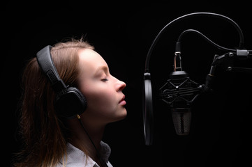 Singer, blogger, voice acting. Work in the studio with a studio microphone.