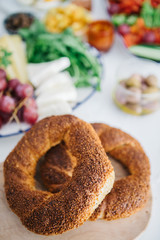 Turkish Breakfast, egg, tomatoes, Cucumber, olive, bread. Turkish fast food bagel called Simit.