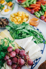 Turkish Breakfast, egg, tomatoes, Cucumber, olive, bread. Turkish fast food bagel called Simit.