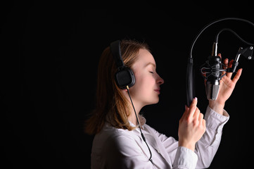 Singer, blogger, voice acting. Work in the studio with a studio microphone.