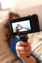 Child vlogger recording self video for vlog
