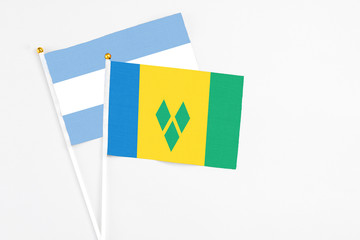 Saint Vincent And The Grenadines and Argentina stick flags on white background. High quality...