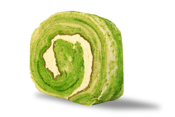 Fototapeta premium Close-up of Green Tea Roll Cake with white cream inside isolated on white background. Dessert concept.
