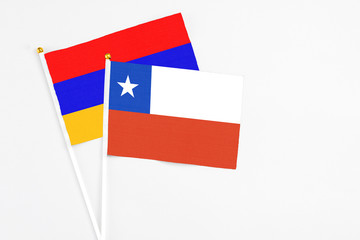 Chile and Armenia stick flags on white background. High quality fabric, miniature national flag. Peaceful global concept.White floor for copy space.