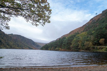 Autumn in the Wicklow Mountains. Glendalough Upper lake, afternoon, calm water, blue sky
