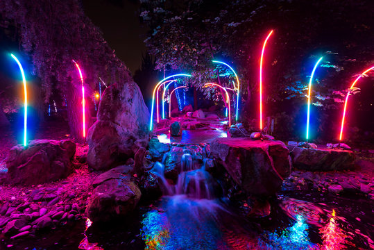 Long Exposure of Light Bars during Light Show with Motion Blur Water