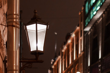vintage wall lamp city architecture. aged historic streetlamp illumination