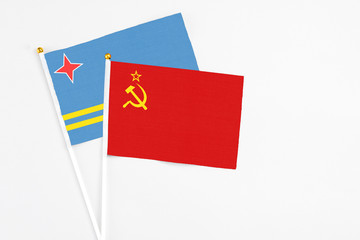 Soviet Union and Aruba stick flags on white background. High quality fabric, miniature national flag. Peaceful global concept.White floor for copy space.