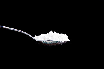 large full spoon of a white powder