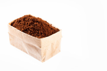 Coffea - Ground beans of organic coffee in paper bag