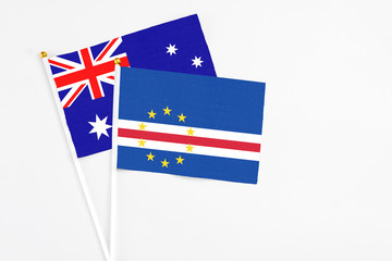 Cape Verde and Australia stick flags on white background. High quality fabric, miniature national flag. Peaceful global concept.White floor for copy space.