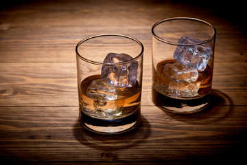 2 glasses of whiskey with ice