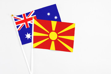 Macedonia and Australia stick flags on white background. High quality fabric, miniature national flag. Peaceful global concept.White floor for copy space.