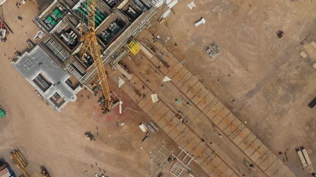 Overhead aerial view of construction site for petrochemical drilling platforms in Port of Qingdao, used for offshore exploration activities in South China Sea and elsewhere