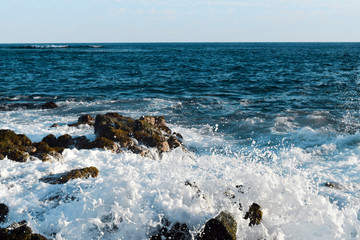 waves crashing on rocks