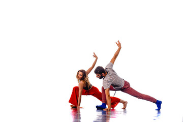 Fototapeta na wymiar Two young breakdancers dancing together