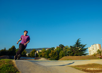 Athletic man preparing to do a flying kick