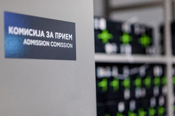 Admission comission sign on a door