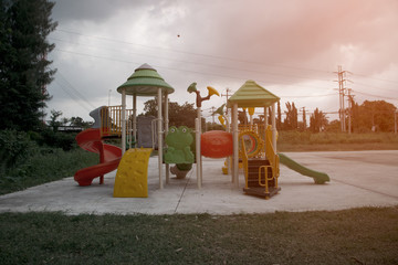 Colorful playground equipment for children in public park.in Thailand.