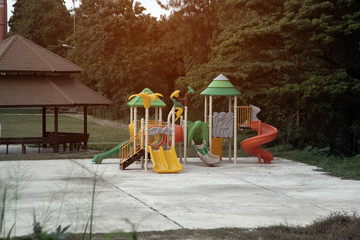 Fototapeta na wymiar Colorful playground equipment for children in public park.in Thailand.